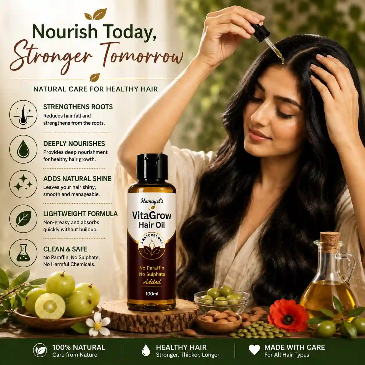 A woman with long, dark, shiny hair applies hair oil from a dropper to her forehead, standing beside a bottle of Hamayel's VitaGrow Hair Oil. The scene is styled with green Amla, nuts, and olive oil, set against a soft-focus outdoor background with promotional text on the left.