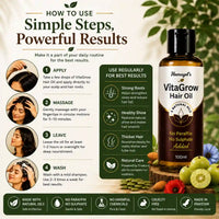 Hamayel's VitaGrow Hair Oil bottle shown on a branded promotional graphic with usage steps, benefits, and ingredient highlights. The bottle is amber glass with a white label and green text, surrounded by hair tools, green leaves, and fruit on a beige background.